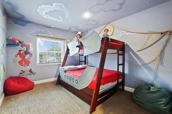 Peter Pan-inspired bedroom with a boat-style bunk bed